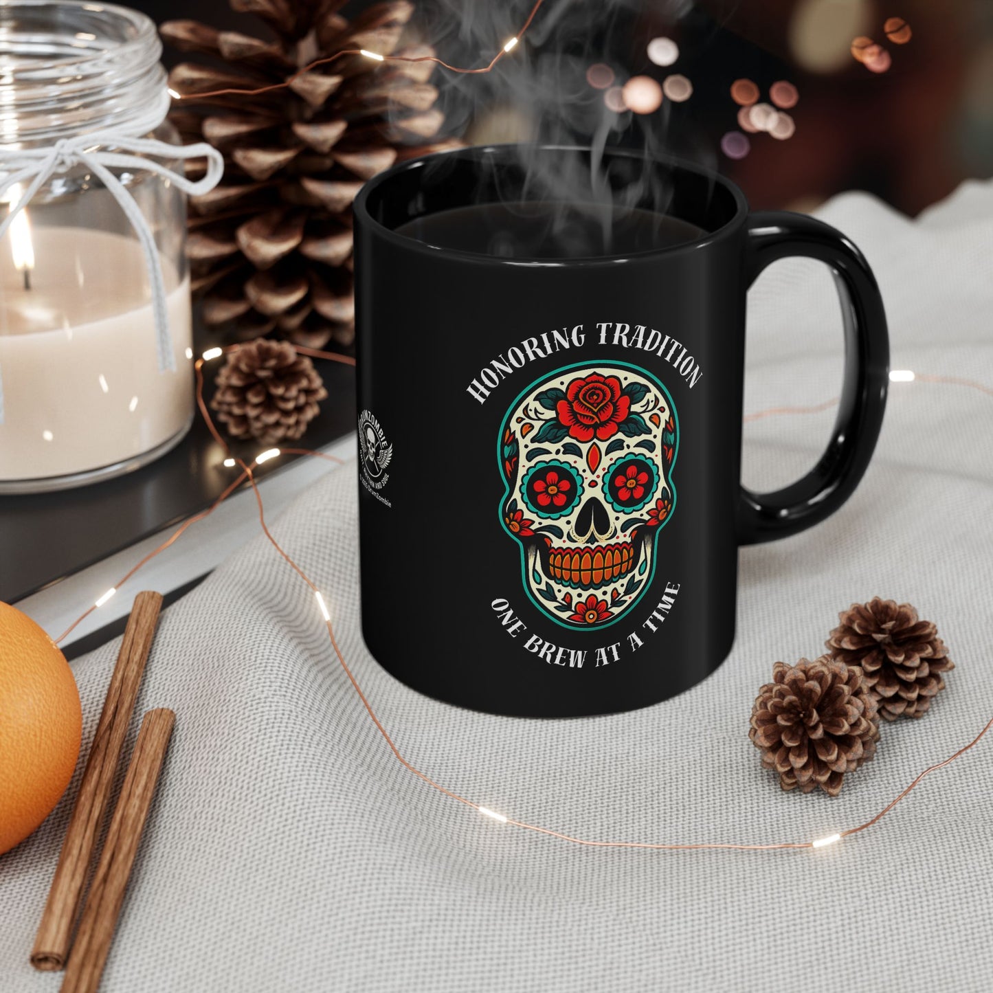 Black ceramic mug with traditional Day of the Dead sugar skull design featuring "Honoring Tradition, One Brew at a Time" text